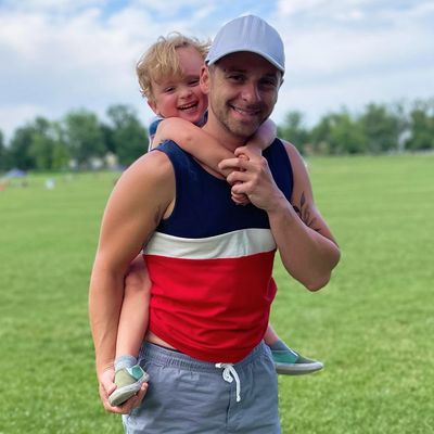 David Estis from Next Level Chiropractic carrying his son on his back