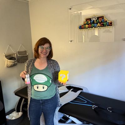 Female patient posing and smiling at the chiropractor practice