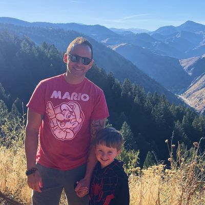 David Estis and his son on a sunny day in the Colorado mountains