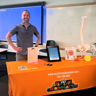 Chiropractor Dr. David Estis showcasing his practice, Next Level Chiropractic, at a networking event
