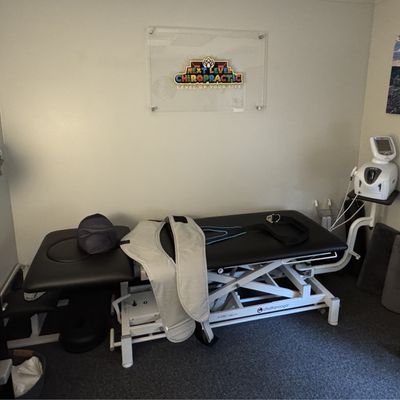 Young child laying face down on chripractic table