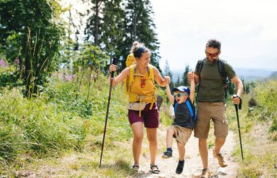 Pain-free family, who have received Next Level Chiropractic care, outdoors hiking in Colorado